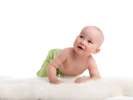 Beautiful baby looking up. Different children search in my portfolioの写真素材