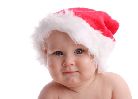 Baby in a Christmas hat on the whiteの写真素材