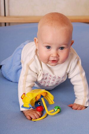 The beautiful happy baby plays with toys 3の写真素材