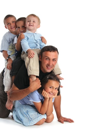 Father plays with four childrenの写真素材