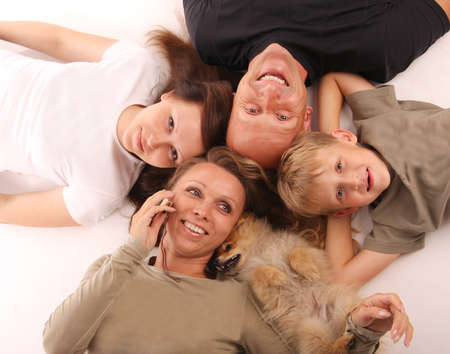 Happiness family with a dogの写真素材