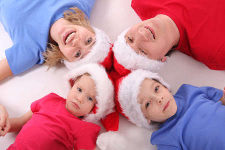 Happy family in Christmas hats 4の写真素材