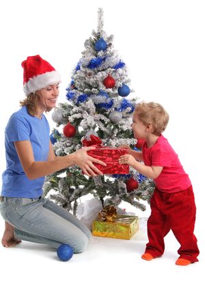 Mum gives a gift to the daughter for Christmas 2の写真素材