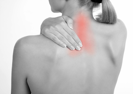 Woman holds a hand on pain neck. Backacheの写真素材
