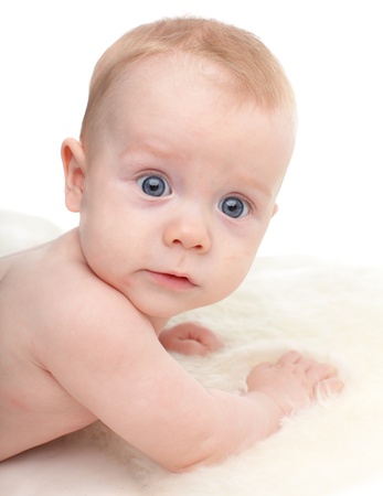 Beautiful baby on a soft rugの写真素材