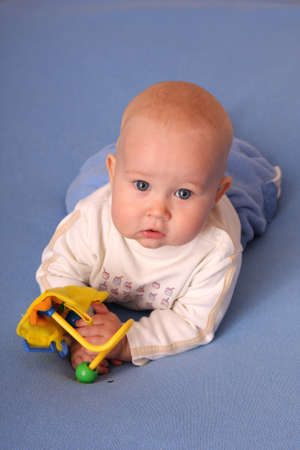 Baby plays with toys の写真素材