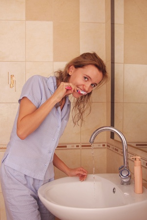 Beautiful woman cleans a teethの写真素材
