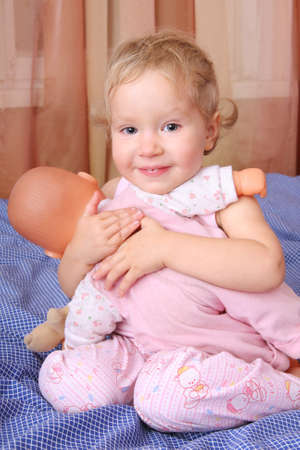 Girl strong embraces the dollの写真素材