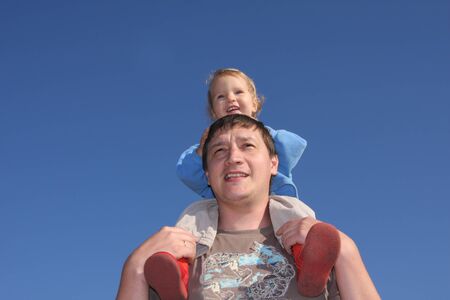 Happy the daddy with a daughter against the sky 4の写真素材