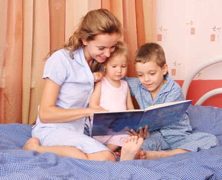 Mum reads the book to the children 2の写真素材