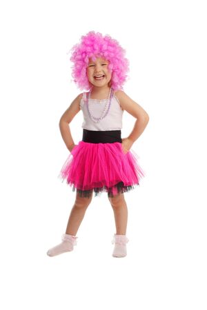 Beautiful little girl in pink wig isolated on whiteの写真素材