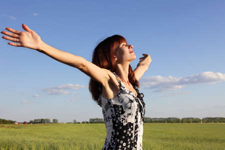 Beautiful woman in the fieldの写真素材