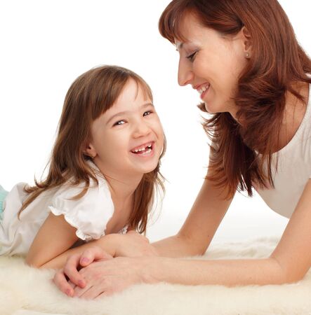 Mother with daughter isolated on whiteの写真素材