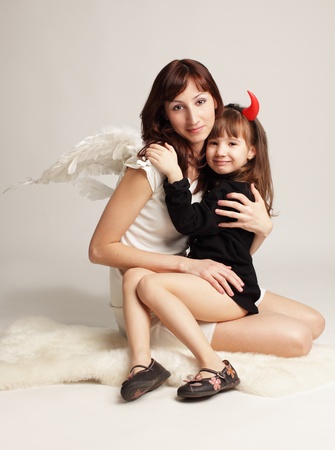Angel and little demon. の写真素材