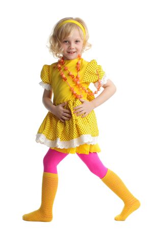 Beautiful little girl in yellow sundressの写真素材