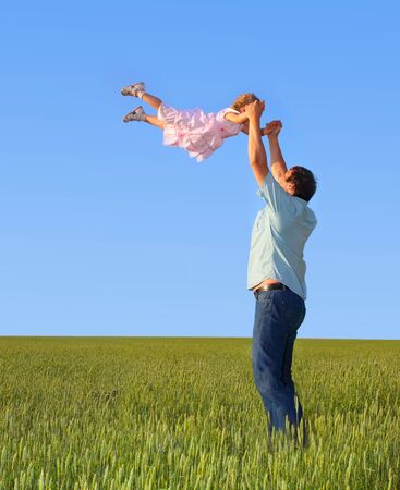 Father throws the daughterの写真素材