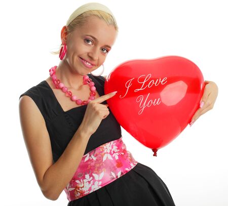 Beautiful woman in an elegant dress with balloonの写真素材