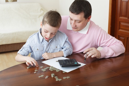 Father training the son to the finance. Seriesの写真素材
