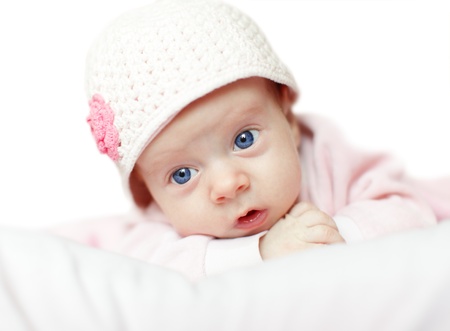 Beautiful blue-eyed baby in cap