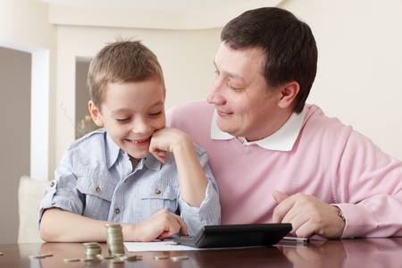 Father training the son to the finance. Seriesの写真素材