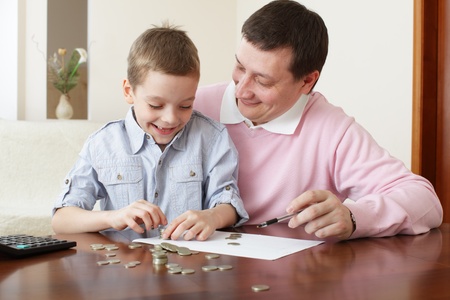 Father training the son to the finance. Seriesの写真素材