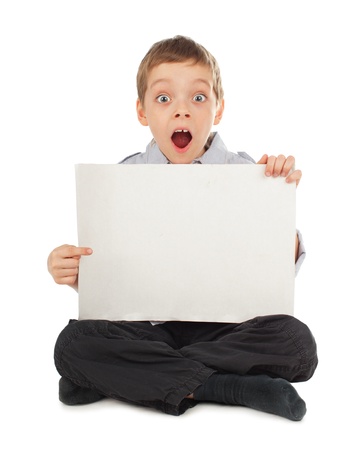 Surprised child with empty blank isolated on whiteの写真素材