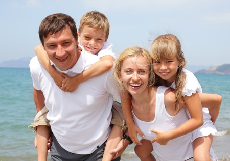 Happy family on the beachの写真素材