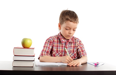 Child doing lessons isolated on whiteの写真素材