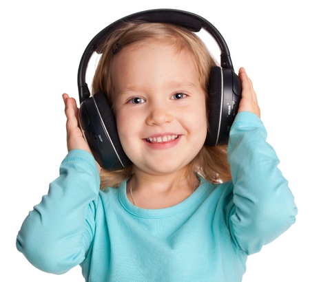 Little child in headphones isolated on whiteの写真素材