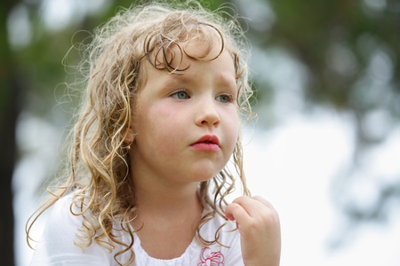 Little sad girl looking awayの写真素材