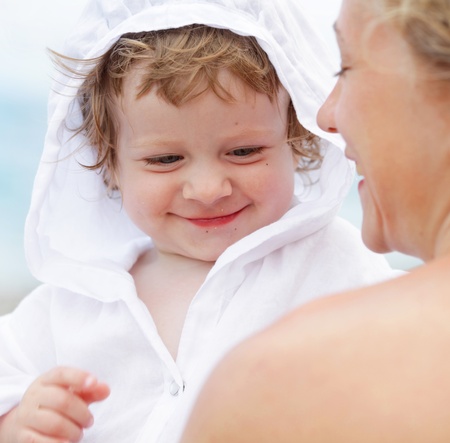 Baby with mother on the beach