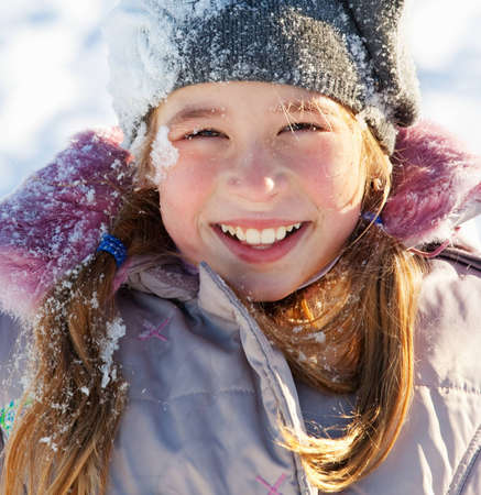 Child in the snow in winter.の写真素材