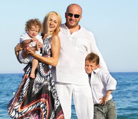 Family on beach. Mother, father and children on beach.の写真素材