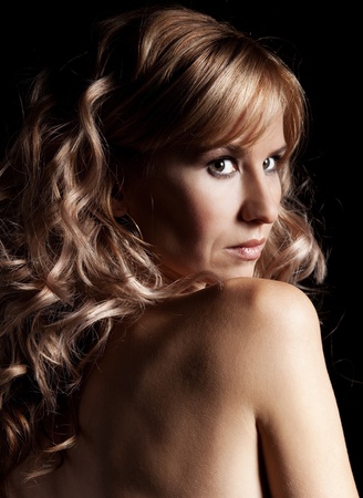 Glamour woman in black dress studio shotの写真素材