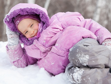 Girl in winter. Happy child on snowの写真素材