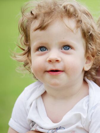 Little happy child looking upの写真素材