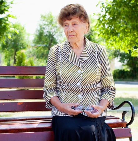 Old woman in park. Happy senior woman.の写真素材