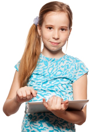 Child looks to the tablet computer. Kid with tablet isolated on white backgroundの写真素材
