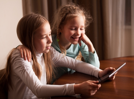 Children playing on tablet. Kids looking at computerの写真素材