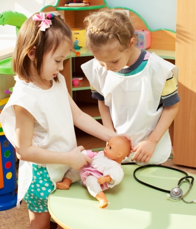 Child in kindergarten. Kids in nursery school. Girl playing at infant schoolの写真素材
