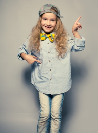 Dansing child. Motions fashion girl studio shotの写真素材