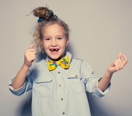 Dansing child. Motions fashion girl studio shotの写真素材