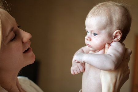 Mother with baby at home. Newbornの写真素材
