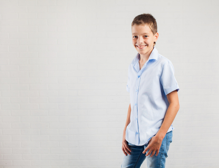 Happy boy. Smiling teenager at schoolの写真素材