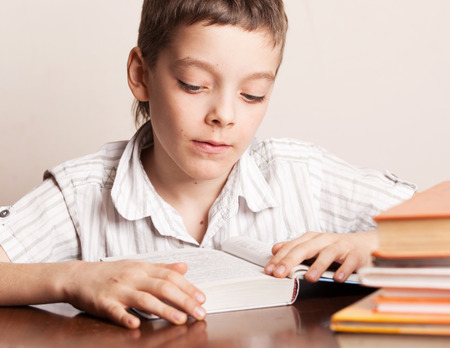 Boy reading book. Child education