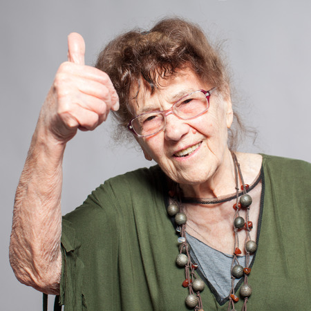Stylish seniors 90 years old woman. Studio shot. Granny femaleの写真素材