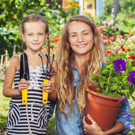 Woman working at garden. Female gardener outdoors. Gardening の写真素材