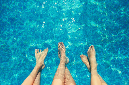 Legs in the pool. Vacation at summerの写真素材