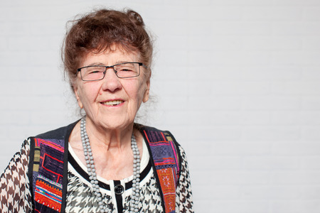 Elderly woman. Studio shot. Happy old femaleの写真素材