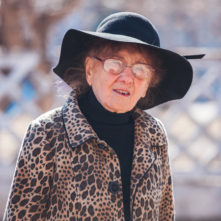 Elderly woman outdoors. Old female